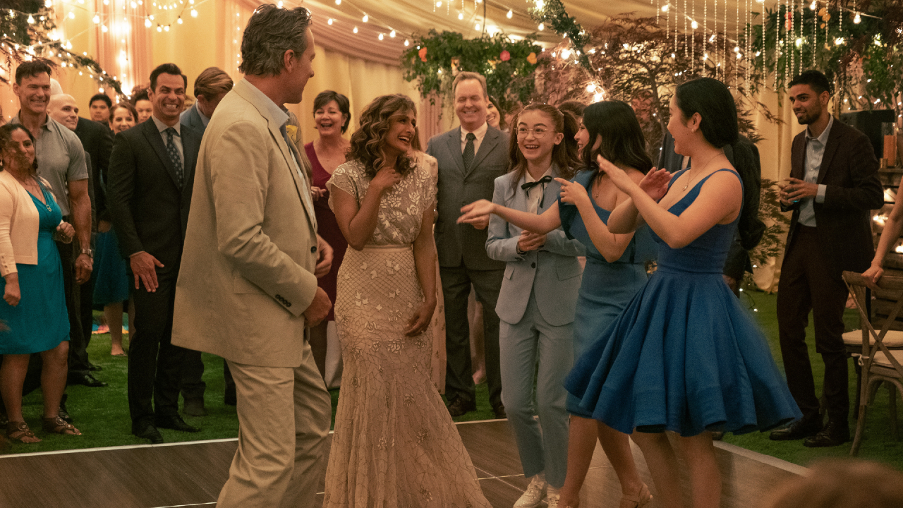 To All The Boys: The Covey family dances together at an outdoor wedding